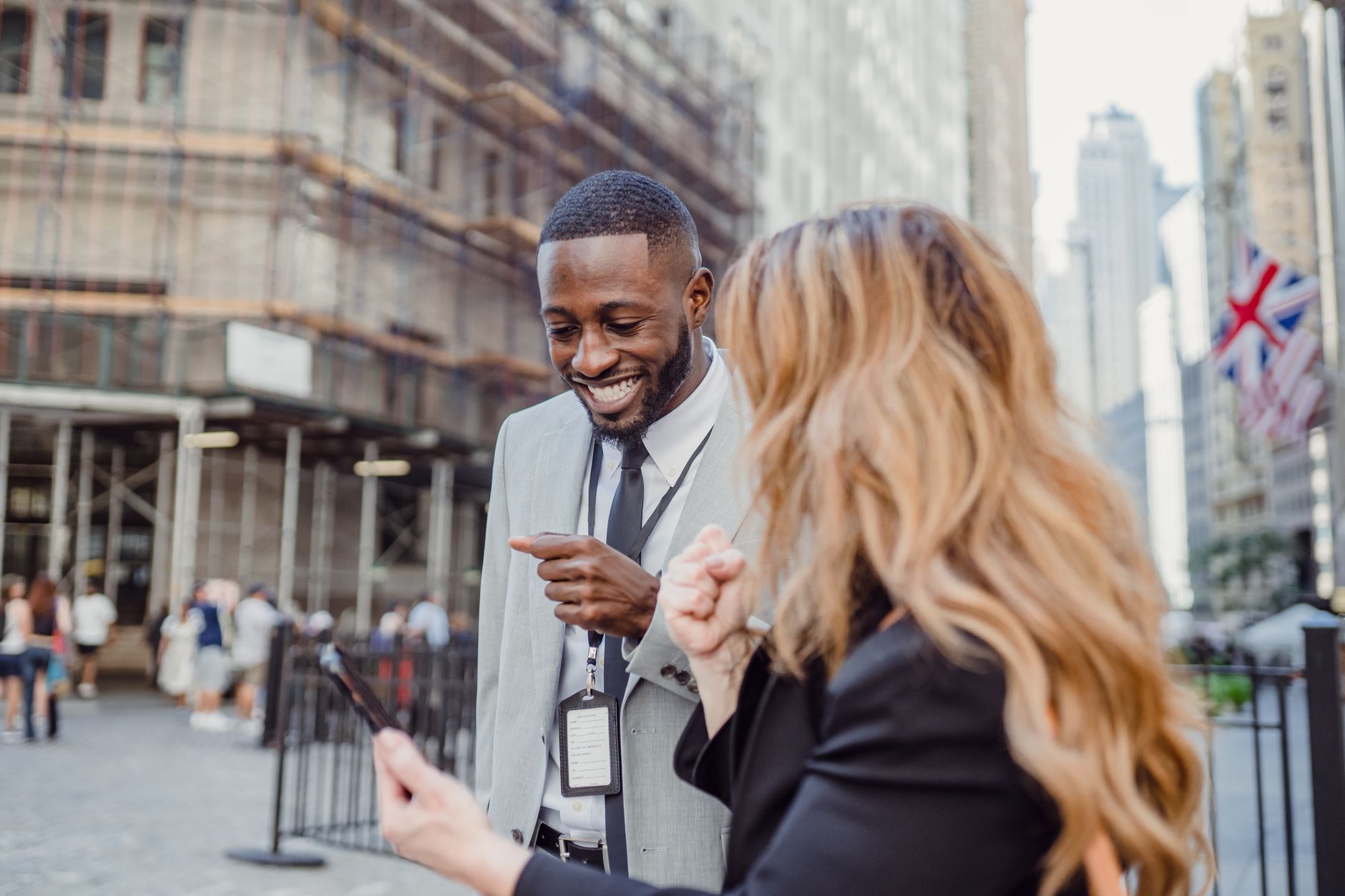 Two business professionals engage in lively conversation on an urban street, sharing insights. — How Dr. Austin Harris Integr
