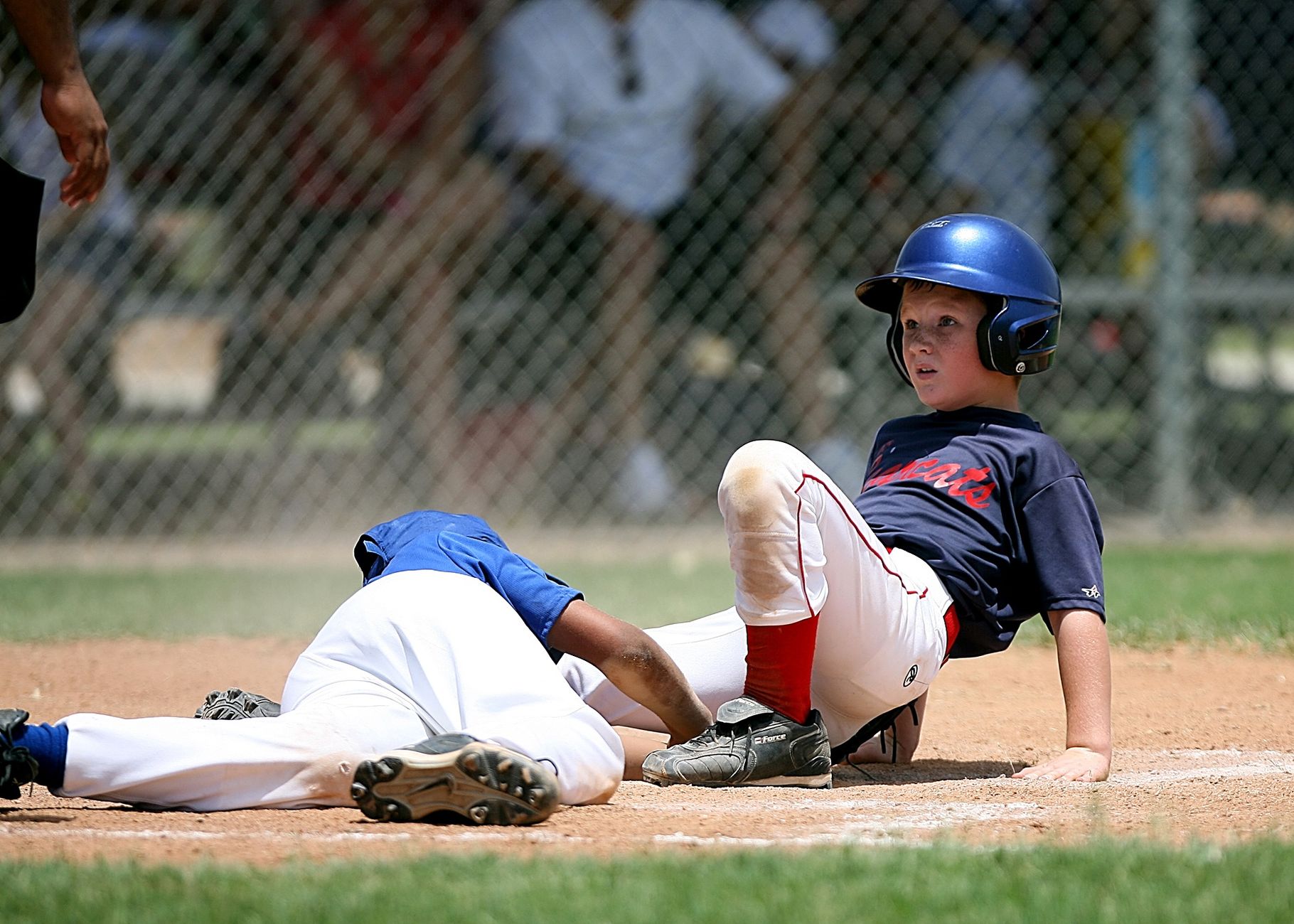 Young baseball players in action during an intense game at a sunlit field. — How to Watch NFL Matches Through Reddit Links