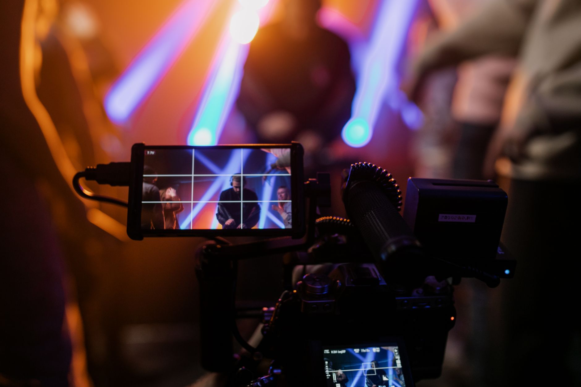 Capturing a vibrant live concert scene with dynamic lighting using professional video equipment. — Stream2Watch’s Official Sp